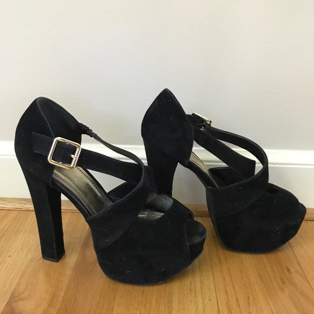 Black velvet heels with gold accents
